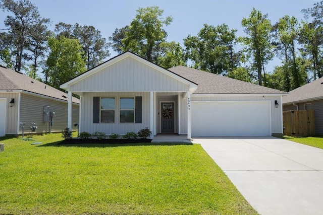 40495 Cara Mae St, Slidell, LA 70461 - single story home featuring board and batten siding, an attached garage, driveway, and a front lawn