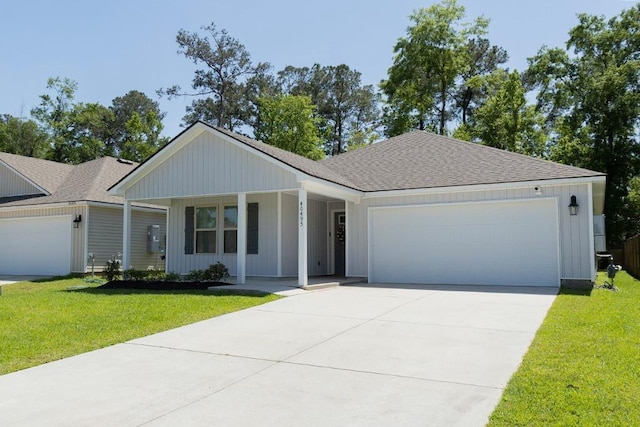 40495 Cara Mae St, Slidell, LA 70461 - single story home with covered porch, a shingled roof, a front lawn, and a garage