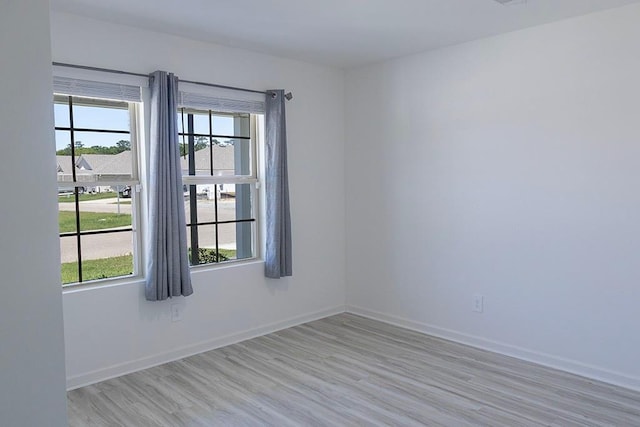 40495 Cara Mae St, Slidell, LA 70461 - unfurnished room with plenty of natural light, light wood-style flooring, and baseboards