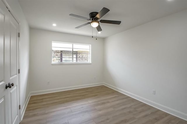 unfurnished bedroom with baseboards, recessed lighting, and wood finished floors
