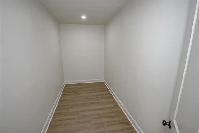 interior space with light wood-style floors, baseboards, and recessed lighting