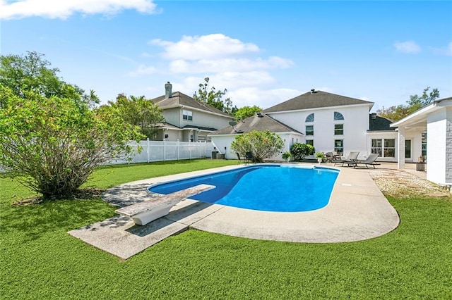 view of pool with a patio area, a fenced in pool, fence, and a lawn
