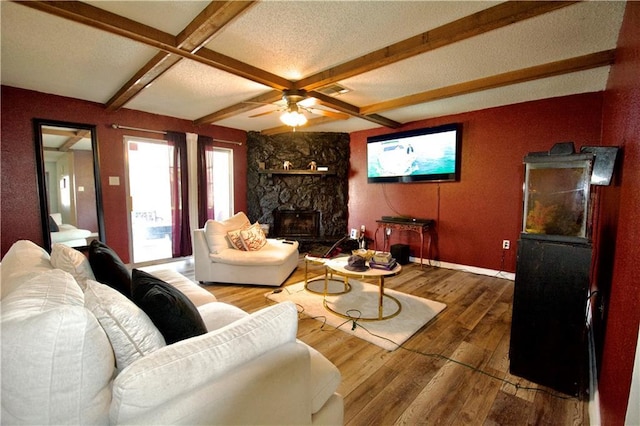 3209 Jennifer Ct, Marrero, LA 70072 - living room featuring hardwood / wood-style flooring, a fireplace, ceiling fan, baseboards, and beamed ceiling