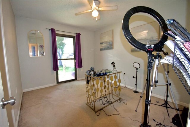3209 Jennifer Ct, Marrero, LA 70072 - exercise room with baseboards, light colored carpet, and ceiling fan