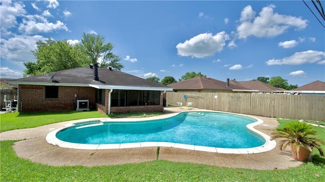 3209 Jennifer Ct, Marrero, LA 70072 - view of swimming pool with central AC and a sunroom