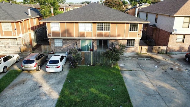 5781 Tullis Dr, New Orleans, LA 70131 - townhome / multi-family property with brick siding and concrete driveway