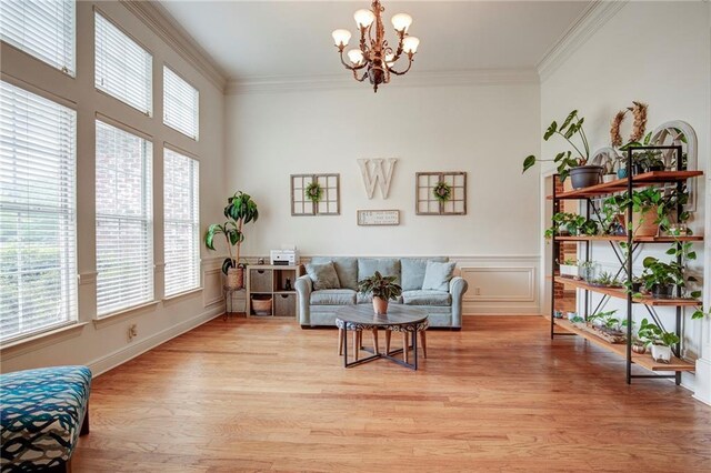 265 Remington Dr, Mandeville, LA 70448 - living area with plenty of natural light, a notable chandelier, and crown molding