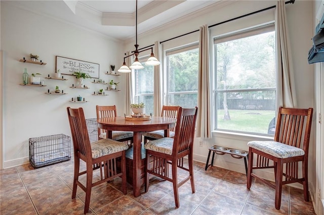265 Remington Dr, Mandeville, LA 70448 - tiled dining area featuring a tray ceiling, baseboards, and ornamental molding
