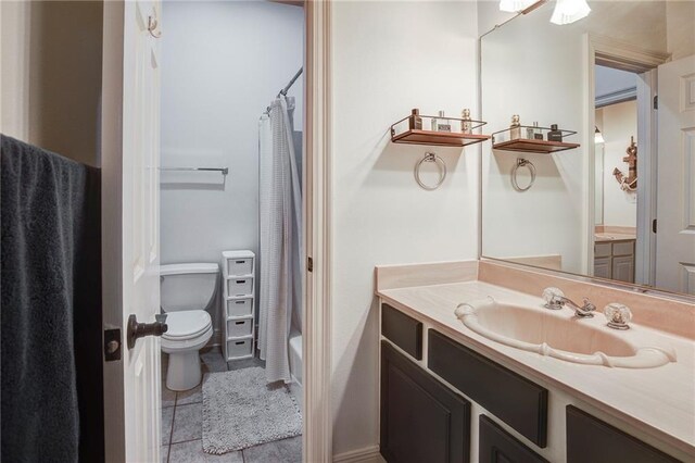 265 Remington Dr, Mandeville, LA 70448 - full bathroom with toilet, vanity, and tile patterned floors