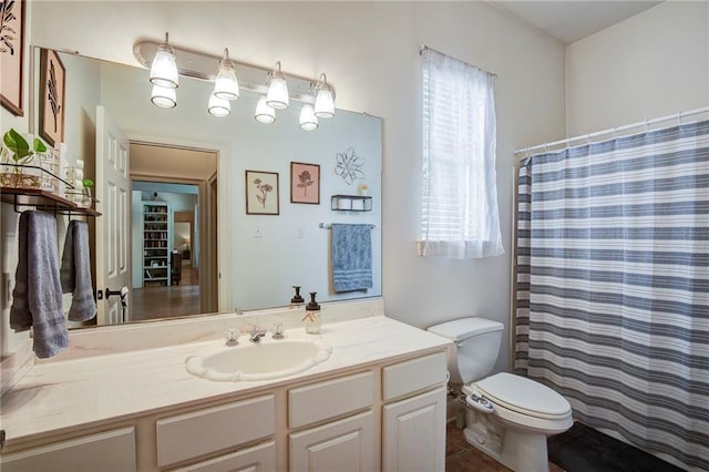 265 Remington Dr, Mandeville, LA 70448 - full bath with a shower with curtain, tile patterned floors, vanity, and toilet