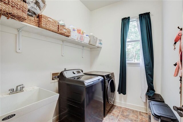 265 Remington Dr, Mandeville, LA 70448 - washroom with washing machine and dryer, baseboards, a sink, and laundry area