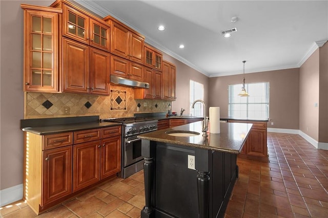 4540 Barataria Blvd, Marrero, LA 70072 - kitchen with stainless steel range, a sink, baseboards, under cabinet range hood, and ornamental molding