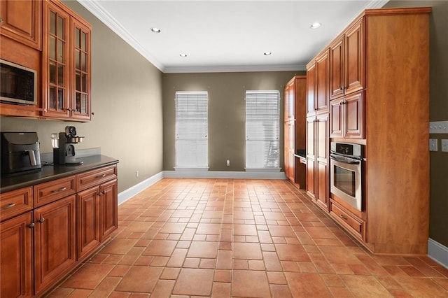 4540 Barataria Blvd, Marrero, LA 70072 - kitchen with appliances with stainless steel finishes, baseboards, brown cabinetry, crown molding, and recessed lighting