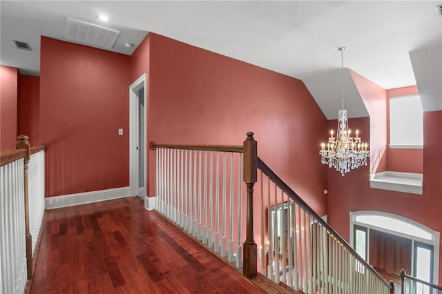 4540 Barataria Blvd, Marrero, LA 70072 - hall with a chandelier, wood finished floors, an upstairs landing, and baseboards