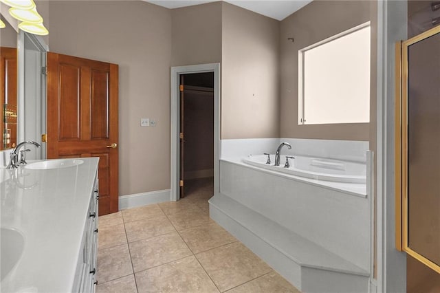 4540 Barataria Blvd, Marrero, LA 70072 - bathroom with tile patterned floors, a garden tub, baseboards, and double vanity