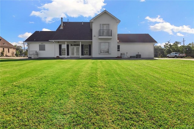4540 Barataria Blvd, Marrero, LA 70072 - back of house featuring french doors, a yard, and a balcony