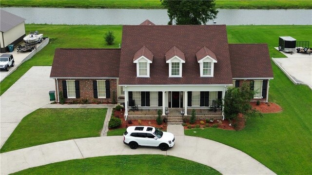 4540 Barataria Blvd, Marrero, LA 70072 - view of front of home featuring a water view, covered porch, and curved driveway