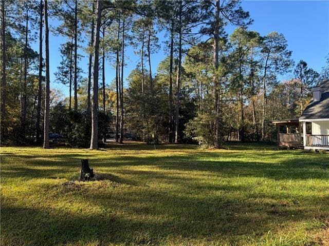 103 Marigold Dr, Covington, LA 70433 - view of green lawn with a deck