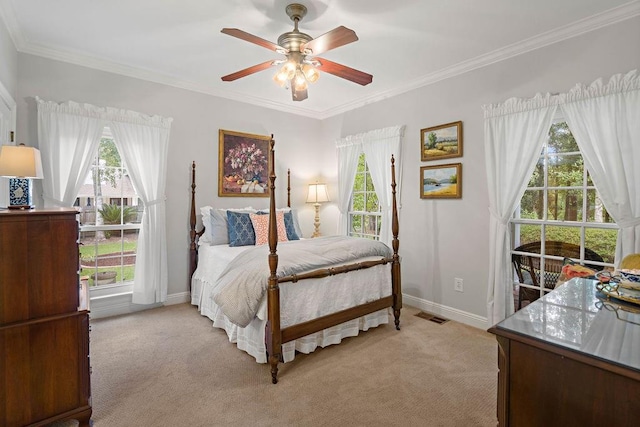 bedroom featuring light colored carpet, visible vents, and multiple windows