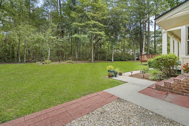 view of yard featuring a wooden deck