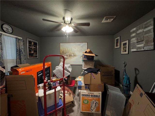 interior space featuring visible vents and a ceiling fan