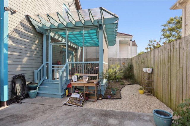 2634 Marengo St, New Orleans, LA 70115 - rear view of house featuring a fenced backyard, a pergola, and a patio area