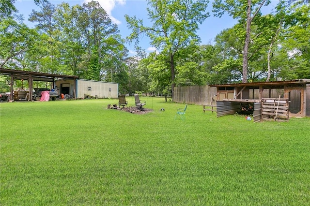 view of yard with an outbuilding and a pole building