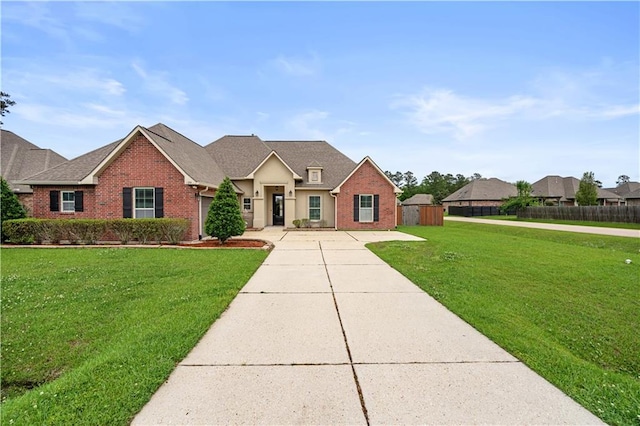 ranch-style house featuring fence, driveway, a front lawn, and brick siding