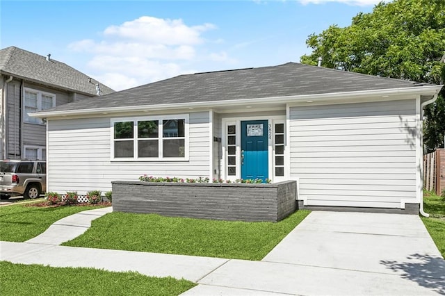 3824 Nashville Ave, New Orleans, LA 70125 - view of front of property with roof with shingles and a front lawn