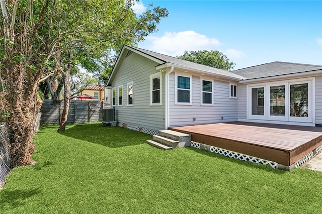 3824 Nashville Ave, New Orleans, LA 70125 - rear view of house with a yard, fence, a wooden deck, and cooling unit