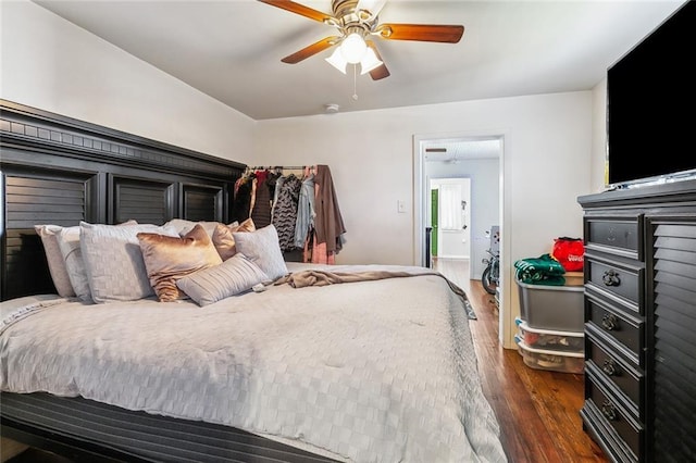 bedroom featuring a ceiling fan and dark wood finished floors