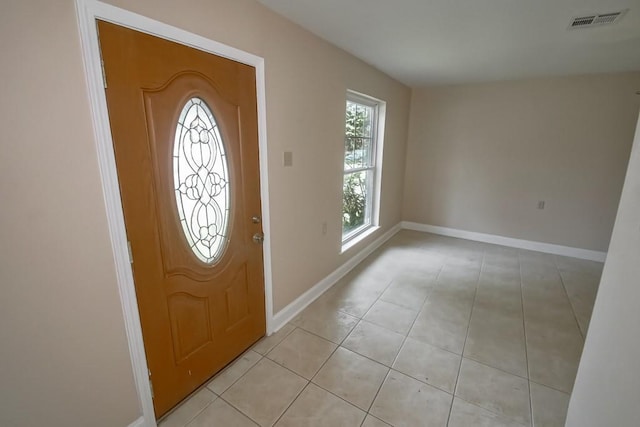3760 W Louisiana State Dr, Kenner, LA 70065 - entryway with baseboards, visible vents, and light tile patterned floors