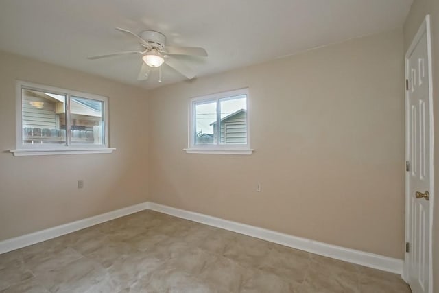 3760 W Louisiana State Dr, Kenner, LA 70065 - empty room with a healthy amount of sunlight, baseboards, and ceiling fan