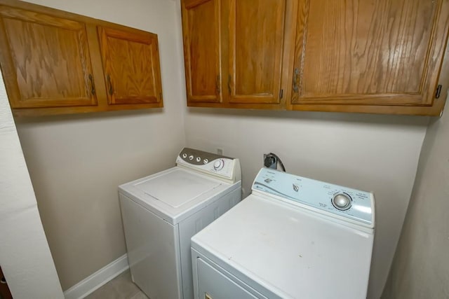 3760 W Louisiana State Dr, Kenner, LA 70065 - laundry area with cabinet space, independent washer and dryer, and baseboards
