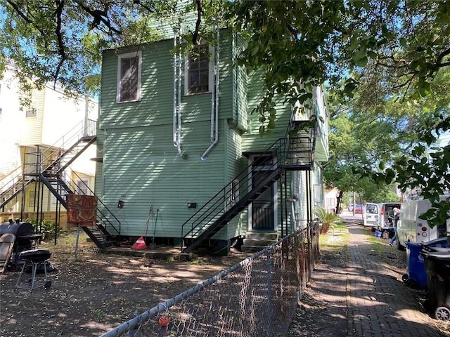 520002 Magazine St, New Orleans, LA 70115 - rear view of property featuring stairs