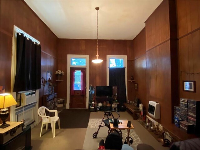 520002 Magazine St, New Orleans, LA 70115 - living room featuring heating unit and carpet floors