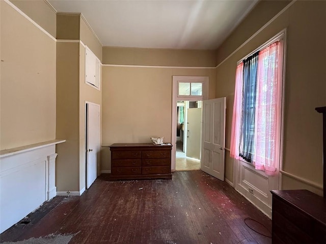 520002 Magazine St, New Orleans, LA 70115 - unfurnished bedroom featuring hardwood / wood-style flooring and baseboards