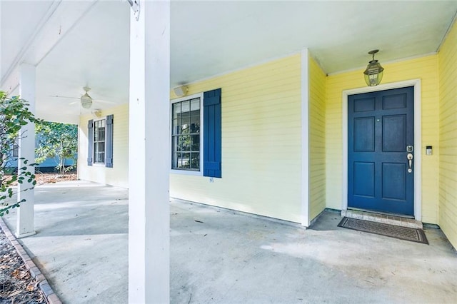 view of exterior entry with covered porch