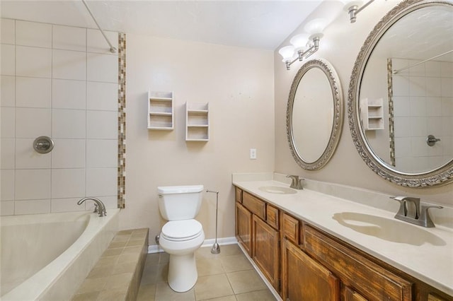 full bathroom featuring tile patterned floors, tiled tub, a sink, and toilet
