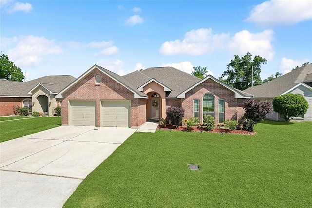 single story home with concrete driveway, a shingled roof, an attached garage, a front yard, and brick siding