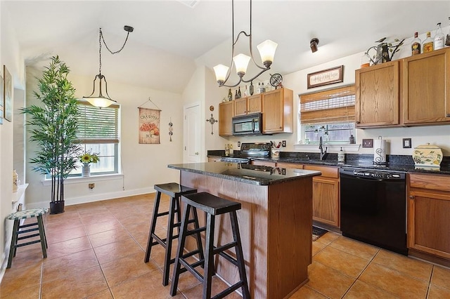 kitchen with light tile patterned floors, plenty of natural light, a sink, and black appliances