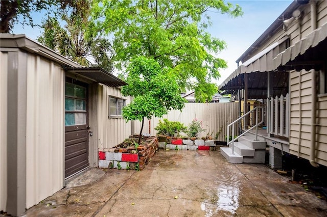 view of patio / terrace featuring fence