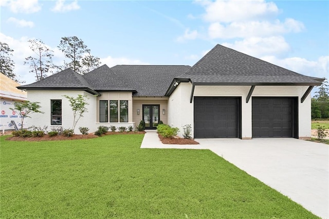 view of front of property with a garage, concrete driveway, a shingled roof, french doors, and a front yard