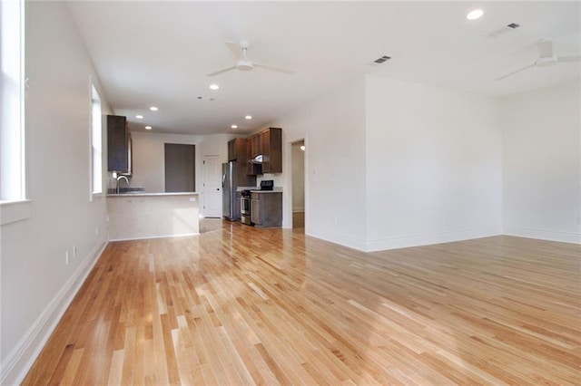 2900 General Taylor St, New Orleans, LA 70115 - unfurnished living room featuring recessed lighting, a ceiling fan, light wood-style flooring, and baseboards
