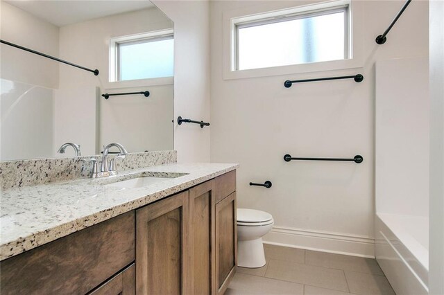 2900 General Taylor St, New Orleans, LA 70115 - full bathroom featuring vanity, tile patterned flooring, baseboards, and toilet