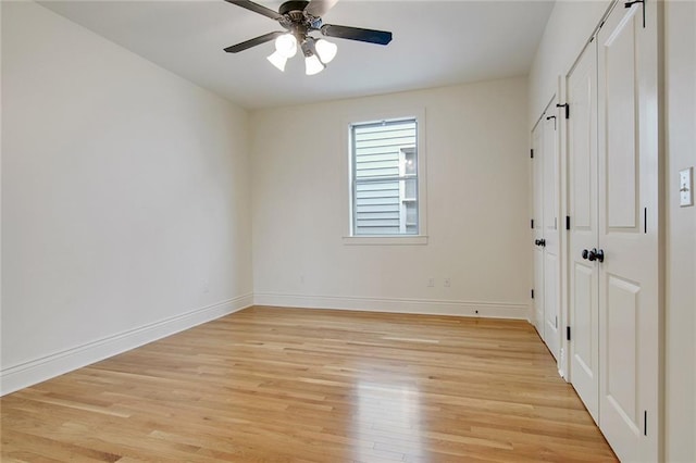 2900 General Taylor St, New Orleans, LA 70115 - unfurnished bedroom featuring baseboards, light wood-style flooring, ceiling fan, and a closet