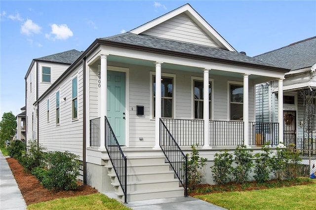 2900 General Taylor St, New Orleans, LA 70115 - view of front of home featuring covered porch and a shingled roof
