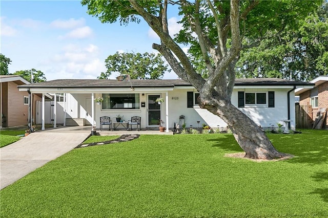 8123 Dalton St, Metairie, LA 70003 - single story home with concrete driveway, an attached carport, and covered porch
