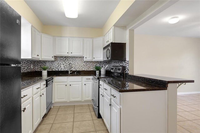 kitchen featuring a sink, a peninsula, black appliances, light tile patterned floors, and white cabinets