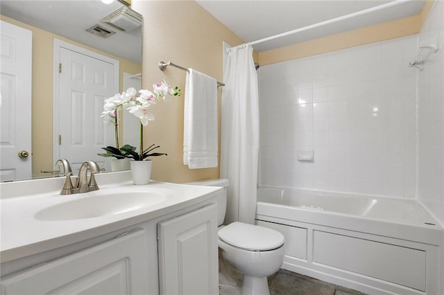 bathroom with toilet, vanity, visible vents, tile patterned floors, and shower / bath combo